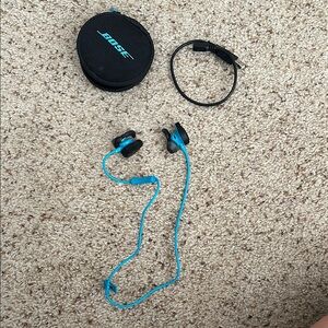 Bose Teal Earbuds with Black Case and Charging Cable